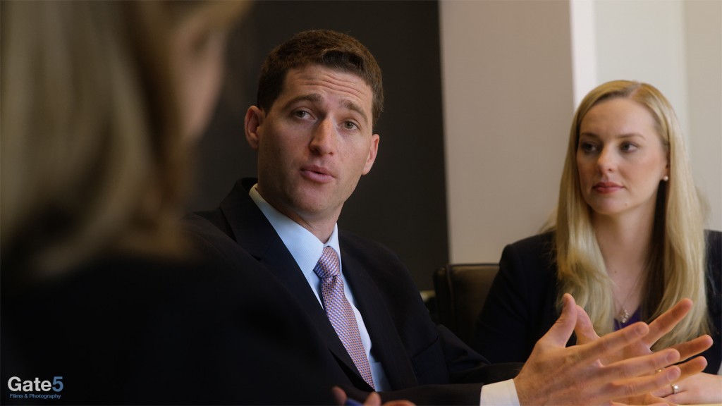 a man and woman in a business meeting in a a corporate video